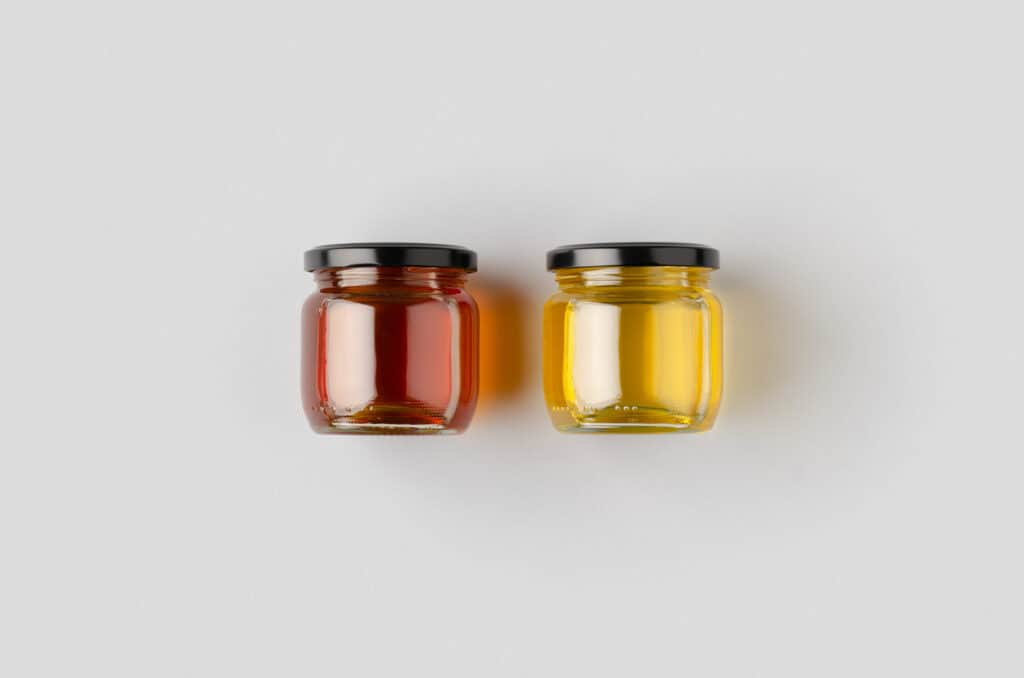 two honey jars side by side