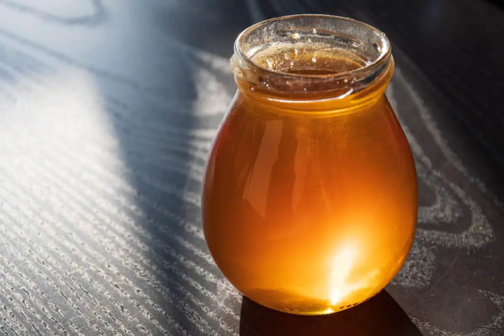 light honey in jar